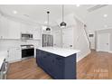 Modern kitchen featuring a center island and dark blue cabinetry at 1002 Fairground St, Charlotte, NC 28208