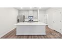 Modern kitchen with white cabinets and center island at 105 Ciara Pl # C, Mooresville, NC 28117