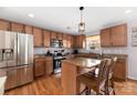 Modern kitchen with granite countertops and island at 160 Hedgewood Dr, Mooresville, NC 28115