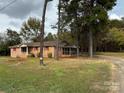 Brick ranch house with screened porch at 925 Rock Grove Church Rd, Salisbury, NC 28146