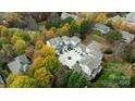Townhome community with a courtyard and autumn foliage at 18819 Cloverstone Cir, Cornelius, NC 28031