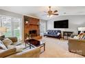 Spacious living room featuring a brick fireplace and large windows at 1500 Beth Haven Church Rd, Denver, NC 28037