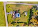 Aerial view of house, pool, detached garage, and expansive property at 4723 Old Mountain Rd, Stony Point, NC 28678