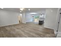 Bright, open-concept living space with hardwood floors leading to a rear patio at 536 Robinhood Rd # 27, Maiden, NC 28650