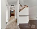 Bright entryway with tile floor, leading to kitchen and stairs at 200 W 18Th St, Newton, NC 28658