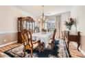 Formal dining room with elegant wood furniture and a chandelier at 2240 Dunnwood Hills Dr, Matthews, NC 28105