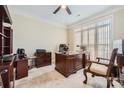 Bright home office with built-in desk and window seat at 2240 Dunnwood Hills Dr, Matthews, NC 28105