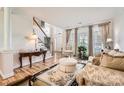 Spacious living room featuring hardwood floors and ample natural light at 2240 Dunnwood Hills Dr, Matthews, NC 28105