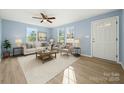 Bright living room with hardwood floors, ample natural light, and stylish furnishings at 108 W Maryland Ave, Bessemer City, NC 28016