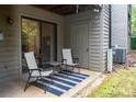Cozy patio with chairs and a table, perfect for relaxing outdoors at 4130 Charlotte Hwy # G, Lake Wylie, SC 29710