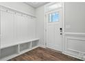 Bright entryway featuring coat hooks, storage bench, and natural light at 6259 Tea Olive Dr # 178, Harrisburg, NC 28075