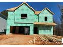 New house under construction, showing exterior framing and house wrap at 1029 Wandsworth Pl # Ken0105, Charlotte, NC 28215