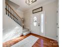 Welcoming entryway with hardwood floors, staircase, and decorative accents at 3195 Hadden Hall Blvd, Fort Mill, SC 29715