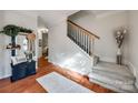 Elegant entryway featuring hardwood floors, staircase, and stylish decor at 3195 Hadden Hall Blvd, Fort Mill, SC 29715