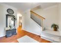 Front foyer with wood floors, coat rack, and stairway to the second floor at 3195 Hadden Hall Blvd, Fort Mill, SC 29715