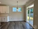 Eat-in kitchen area with sliding glass doors that provide access to outdoor living at 5112 Heathland Dr # 75, Charlotte, NC 28215