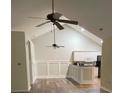 Open living room with high ceilings, ceiling fans, updated lighting and an eat-in kitchen with stainless steel appliances at 9013 Trellis Pointe Blvd, Charlotte, NC 28227