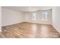 Bright and airy living room features light hardwood floors and neutral walls at 1310 S Branch Dr, Edgemoor, SC 29712