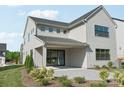 Back exterior view of house featuring patio and sliding glass door at 15008 Brownleigh Ln # 29, Huntersville, NC 28078