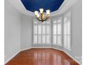 Bright dining room with hardwood floors, plantation shutters, and stylish chandelier at 2106 Yellowstone Dr, Fort Mill, SC 29707