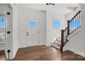 Bright foyer with hardwood floors, staircase, and natural light streaming through windows at 2237 Millennium Dr # 012, Lancaster, SC 29720