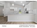 Bright, modern kitchen featuring granite countertops and stainless steel appliances at 204 Lake George Dr, Shelby, NC 28152