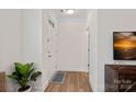 Bright foyer with hardwood floors, white walls, and a view of the front door at 208 Waterlynn Ridge Rd # B, Mooresville, NC 28117