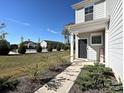 Townhome with walkway leading to front door and view of community pool at 4127 Steel Way, Sherrills Ford, NC 28673