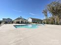 Community pool with a large deck and shaded seating area at 4127 Steel Way, Sherrills Ford, NC 28673