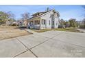 Two-story home with a spacious front yard and driveway at 154 W End St, Chester, SC 29706