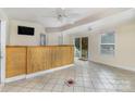 Bright living room with bamboo bar and tile flooring, leading to outdoor space at 1047 Mallard Dr, Rock Hill, SC 29732