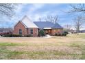 Beautiful brick house with a turret-style window bay and an expansive front lawn at 1825 Smyre Farm Rd, Newton, NC 28658