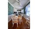 Bright dining area with hardwood floors and a charming table set at 150 Wilson St, Chester, SC 29706