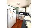 White kitchen cabinets, dark countertops, and a spacious layout at 150 Wilson St, Chester, SC 29706
