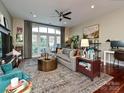 Spacious living room with hardwood floors and a cozy seating area at 1903 Kenilworth Ave # 303A, Charlotte, NC 28203