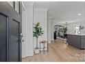 Bright and airy entryway with hardwood floors and a view of the kitchen at 1320 Brook Rd, Charlotte, NC 28205