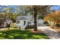 White house with gray roof and landscaped yard at 1320 Brook Rd, Charlotte, NC 28205