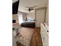 Comfortable bedroom with a queen bed, modern furniture, and a light fixture, creating a warm ambiance at 2100 Temple St, Kannapolis, NC 28081