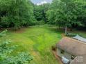 Overhead view of a spacious backyard with mature trees offering ample privacy at 2109 Rock Springs Cir, Denver, NC 28037