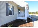 Side view of house showcasing the gray siding and white porch at 310 Genell Ln, Rock Hill, SC 29730