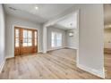 Light-filled entryway with hardwood floors and view to dining area at 636 Edwards Rd, Fort Lawn, SC 29714