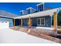Inviting front porch with wooden columns and brick base at 636 Edwards Rd, Fort Lawn, SC 29714