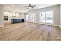 Modern kitchen with white cabinets, large island, and stainless steel appliances at 636 Edwards Rd, Fort Lawn, SC 29714