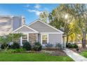 Gray siding house with stone accents and well-manicured lawn at 1835 Fairlawn Ct, Rock Hill, SC 29732