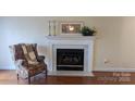 Cozy living room with a marble fireplace and hardwood floors at 1835 Fairlawn Ct, Rock Hill, SC 29732