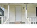 Close-up of the front door displaying the house number and lighting fixture at 408 E Washington Ave, Bessemer City, NC 28016