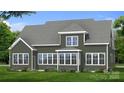 Rear view of a two-story home with large windows, green siding, a roof, and a well-manicured lawn at 4271 Candlewood Dr, Sherrills Ford, NC 28673