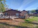 Spacious backyard with wooden deck and fenced area at 4706 Calico Ct, Charlotte, NC 28212