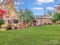 Ranch style stone house with a large green lawn at 501 W Maryland Ave, Bessemer City, NC 28016