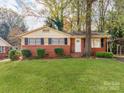 Brick ranch house with a spacious yard at 7101 Ridgebrook Dr, Charlotte, NC 28210